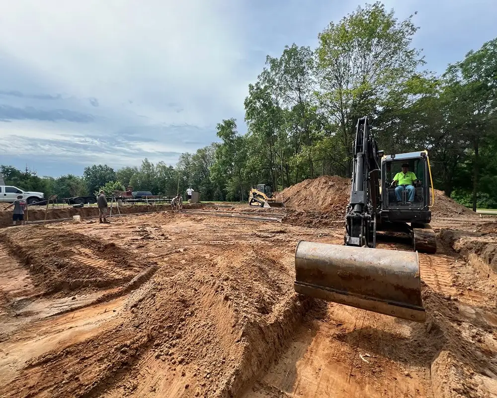 Crawl space foundation excavation work at Camp Michawana