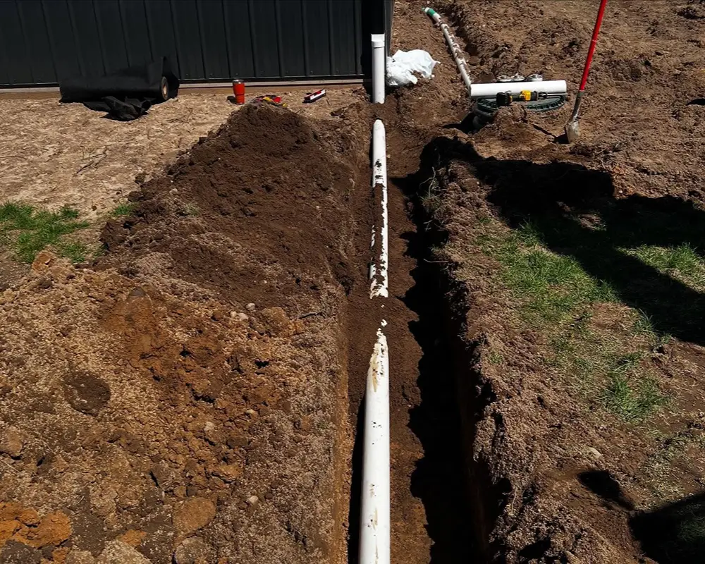 Underground drainage pipe being installed