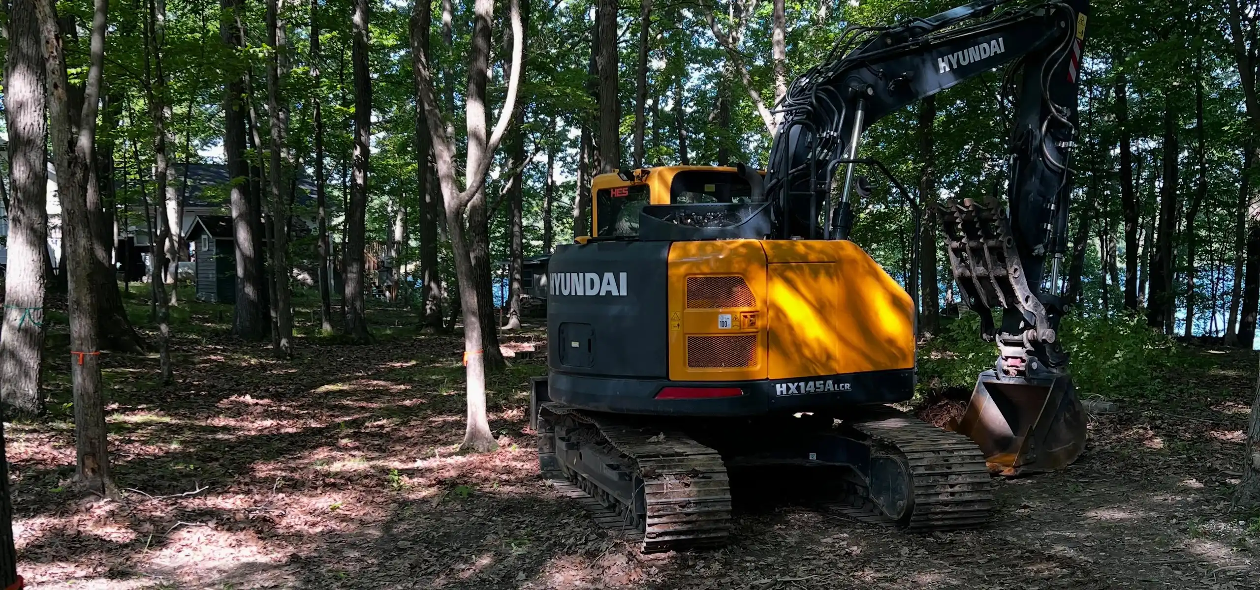 R&H Tractor Services clearing an overgrown property in West Michigan