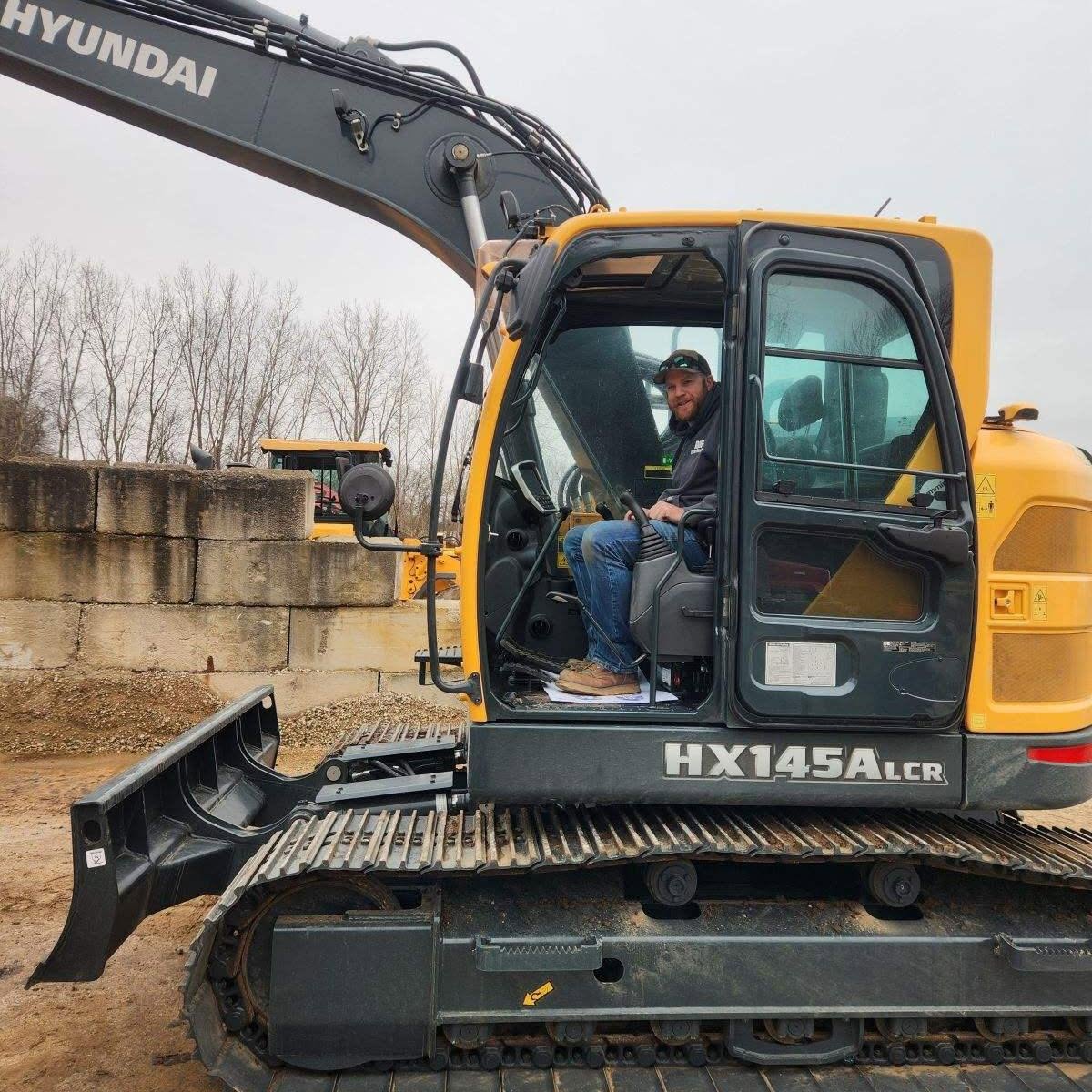 Ryan Groat operating excavation equipment at R&H Tractor Services