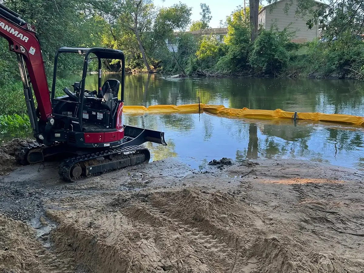 R&H Tractor Services team taking a break during the Thornapple River restoration project